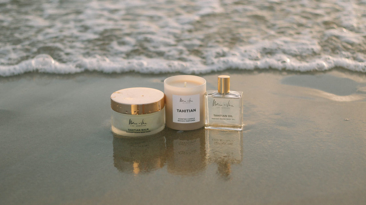 Marine + Vine Tahitian Balm, Candle and Oil on the shoreline